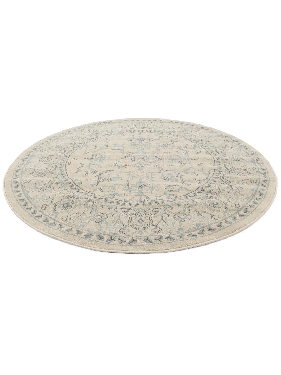 Rond tapijt in beige en lichtblauw met traditionele patronen