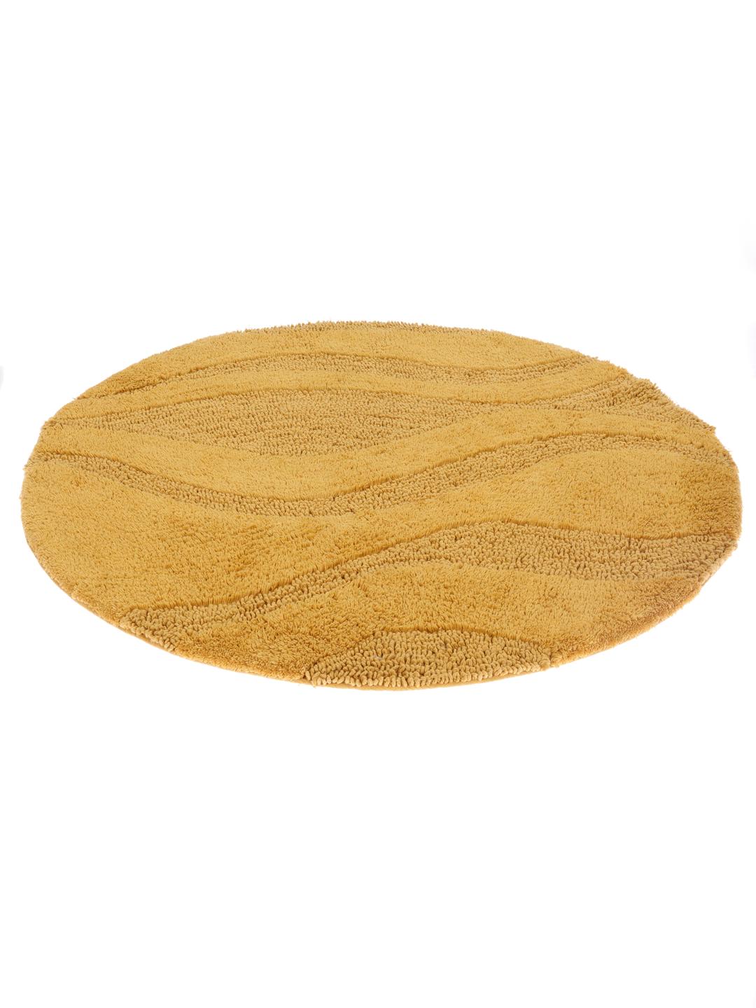 Ronde gele badmat met een gestreept textuurpatroon