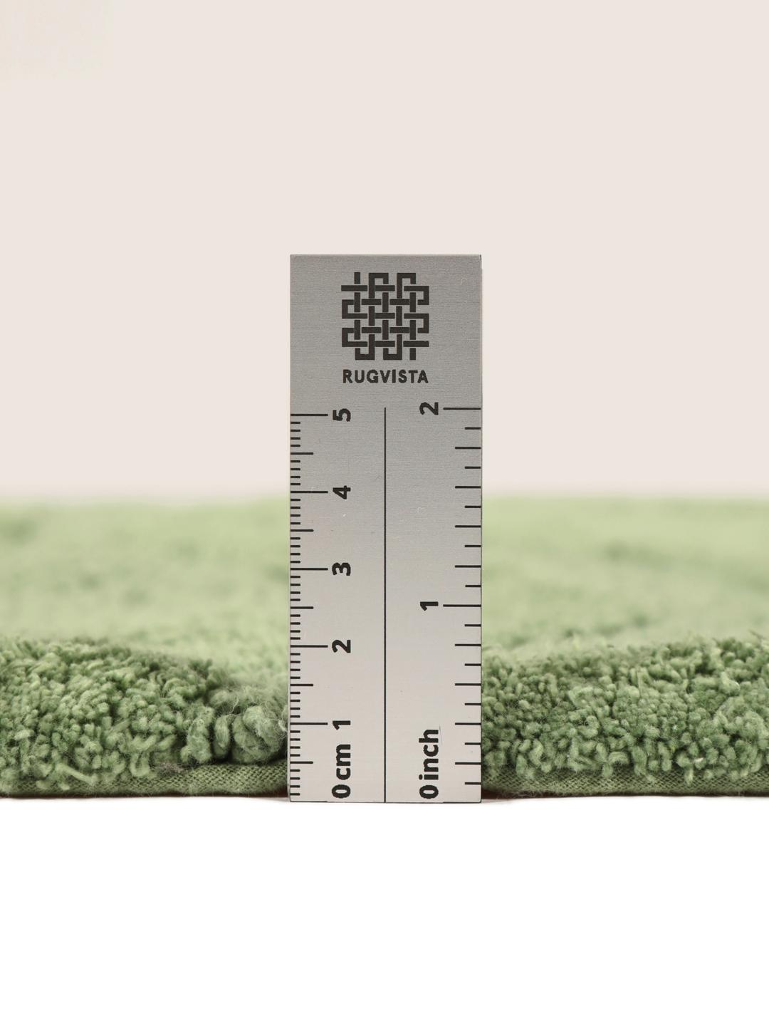 Tapis de bain rond vert avec un motif de vagues texturé