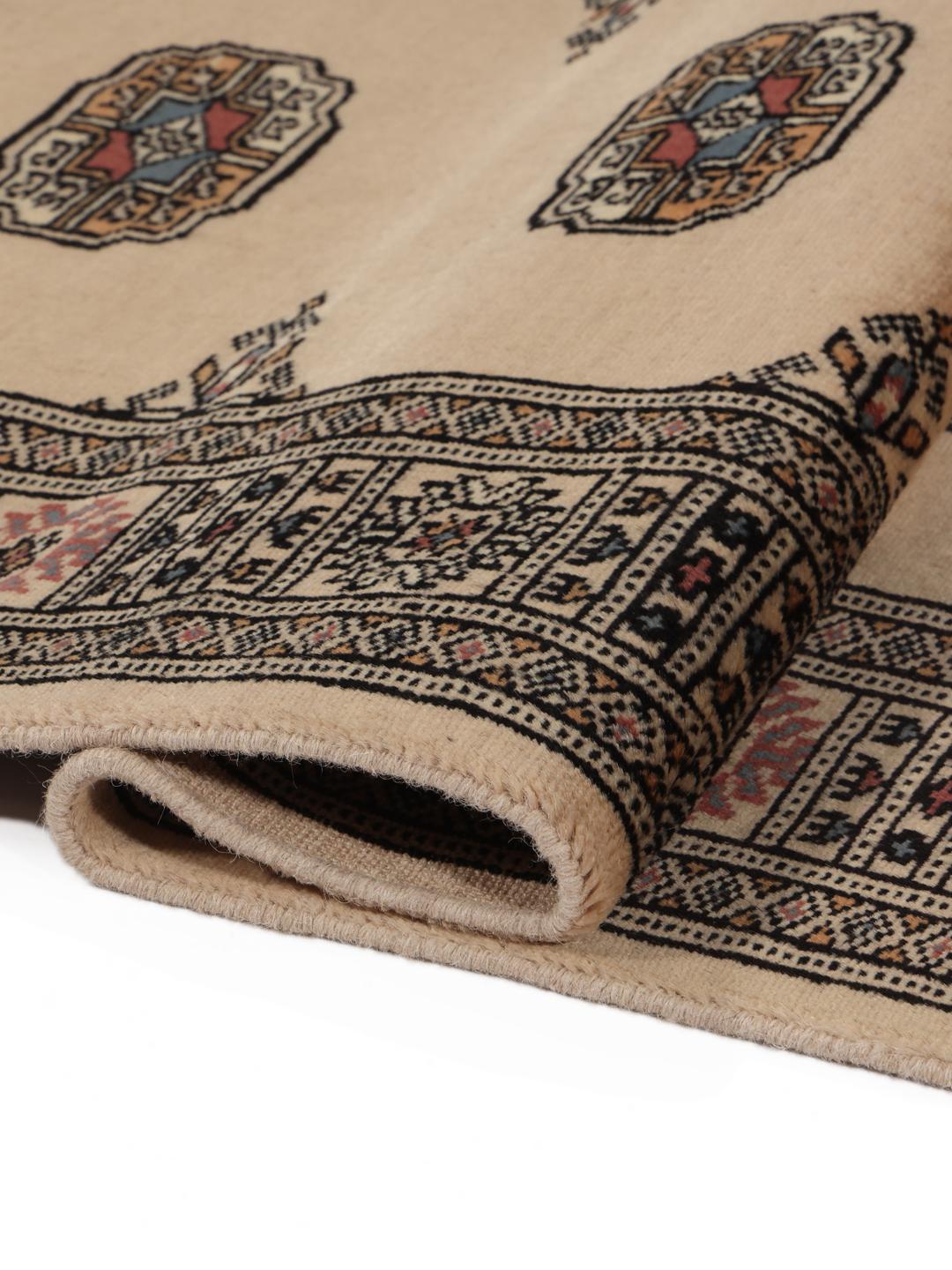 Handgeknoopte beige loper uit Pakistan met traditionele geometrische patronen