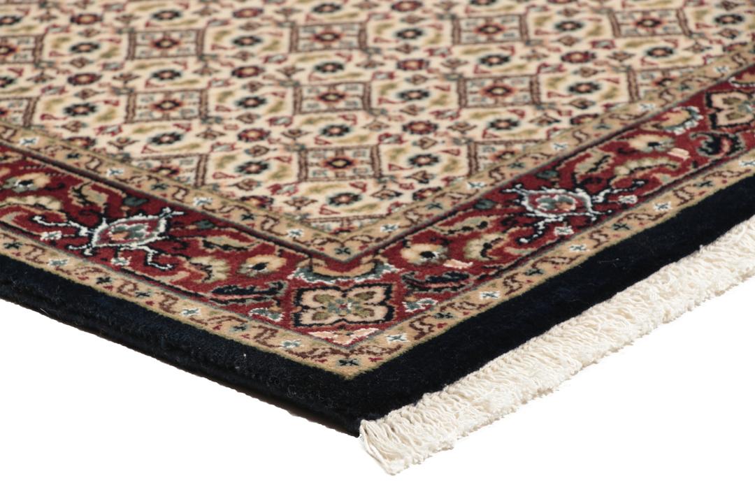 En håndlavet Moud løber med beige felt og røde kanter fra Indien
