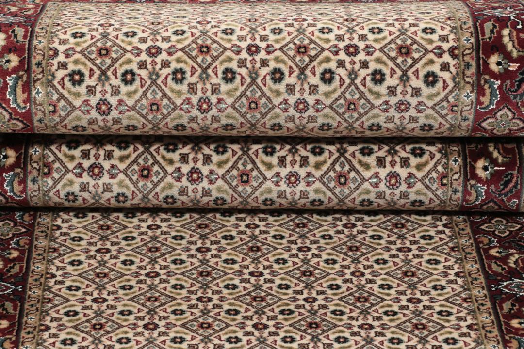 En håndlavet Moud løber med beige felt og røde kanter fra Indien