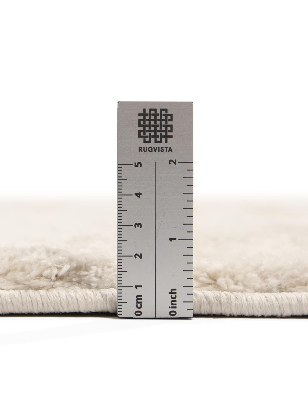 crèmewit vloerkleed met uitgesneden lijndetails