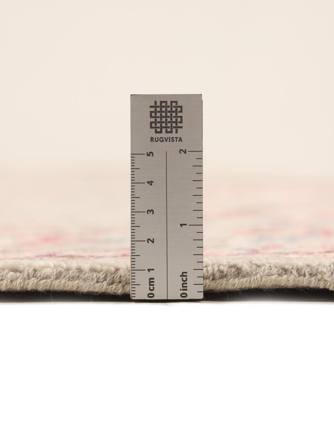 Håndknyttet beige tæppe med blomstermotiver af indisk oprindelse