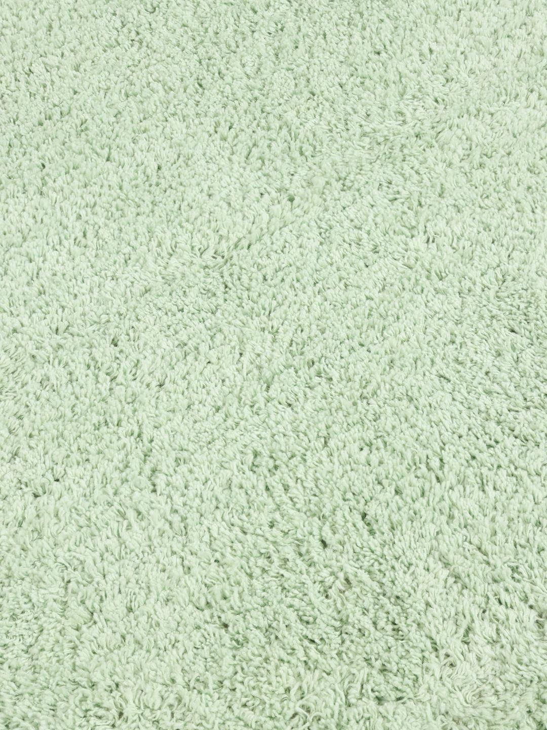 Een wolkvormig mintgroen tapijt