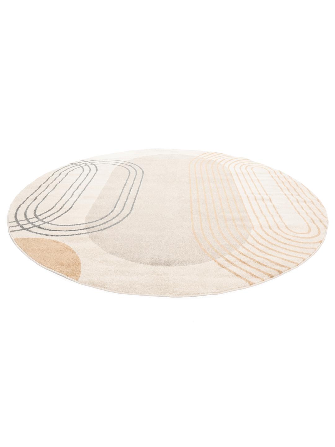 Een rond beige en geel tapijt met abstracte geometrische lijnen.