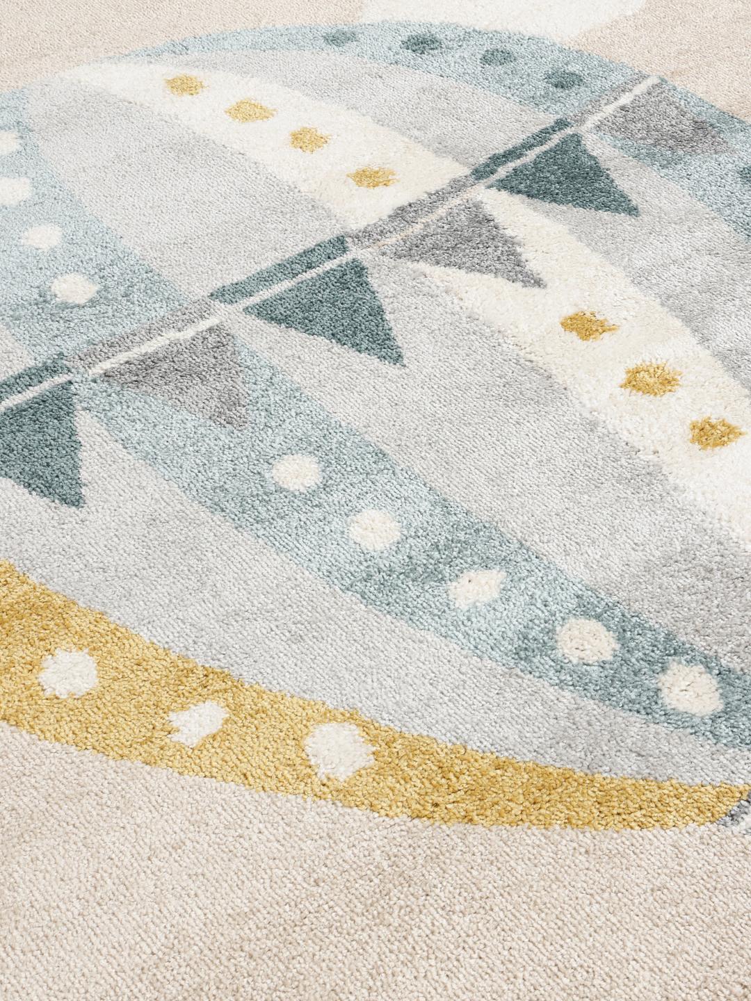 Rond vloerkleed met een luchtballonpatroon in beige en blauw