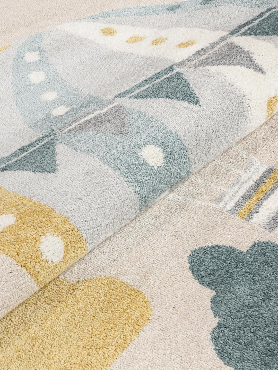 Rond vloerkleed met een luchtballonpatroon in beige en blauw