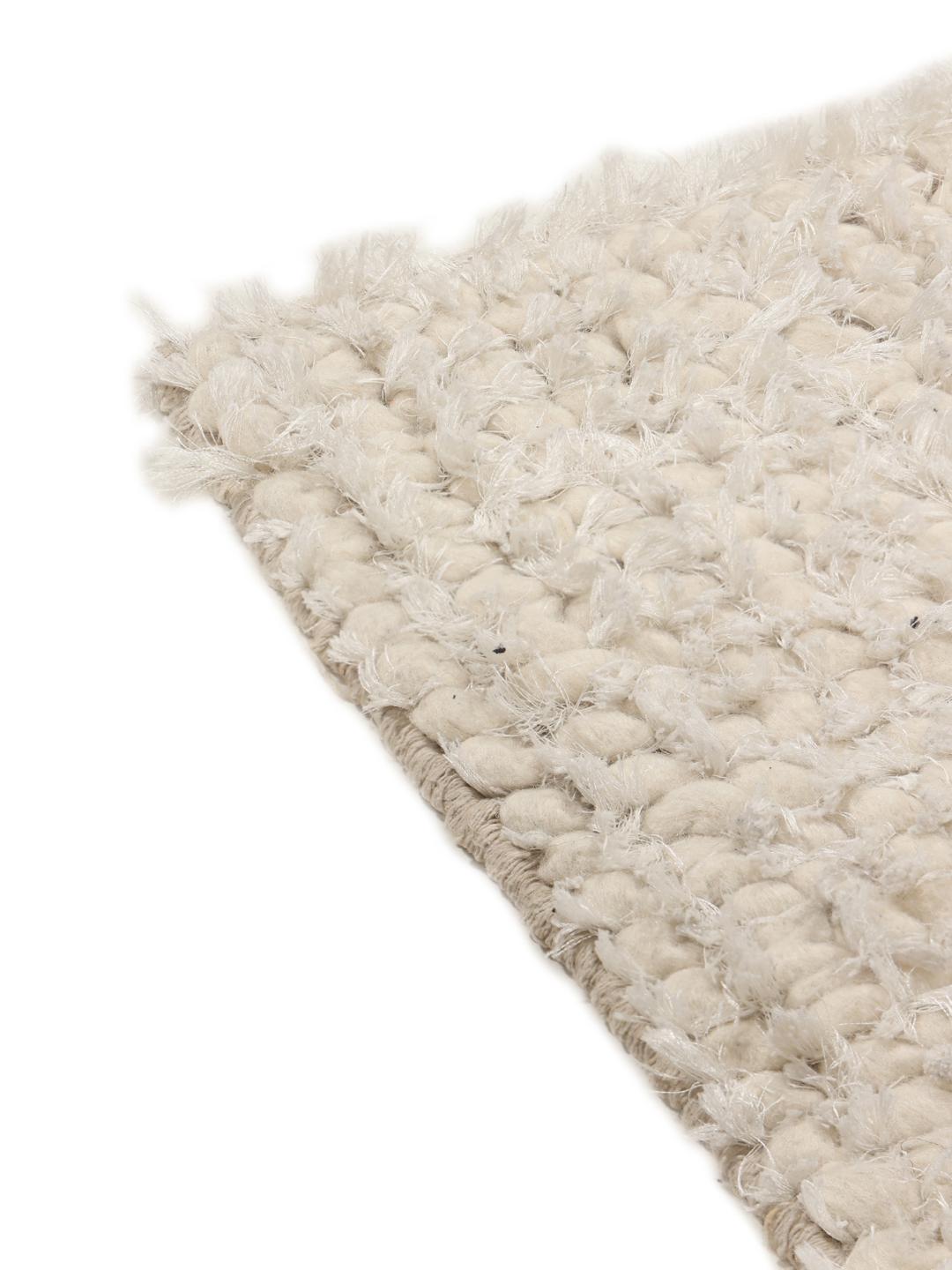 Beige gestructureerd tapijt met een zachte pool
