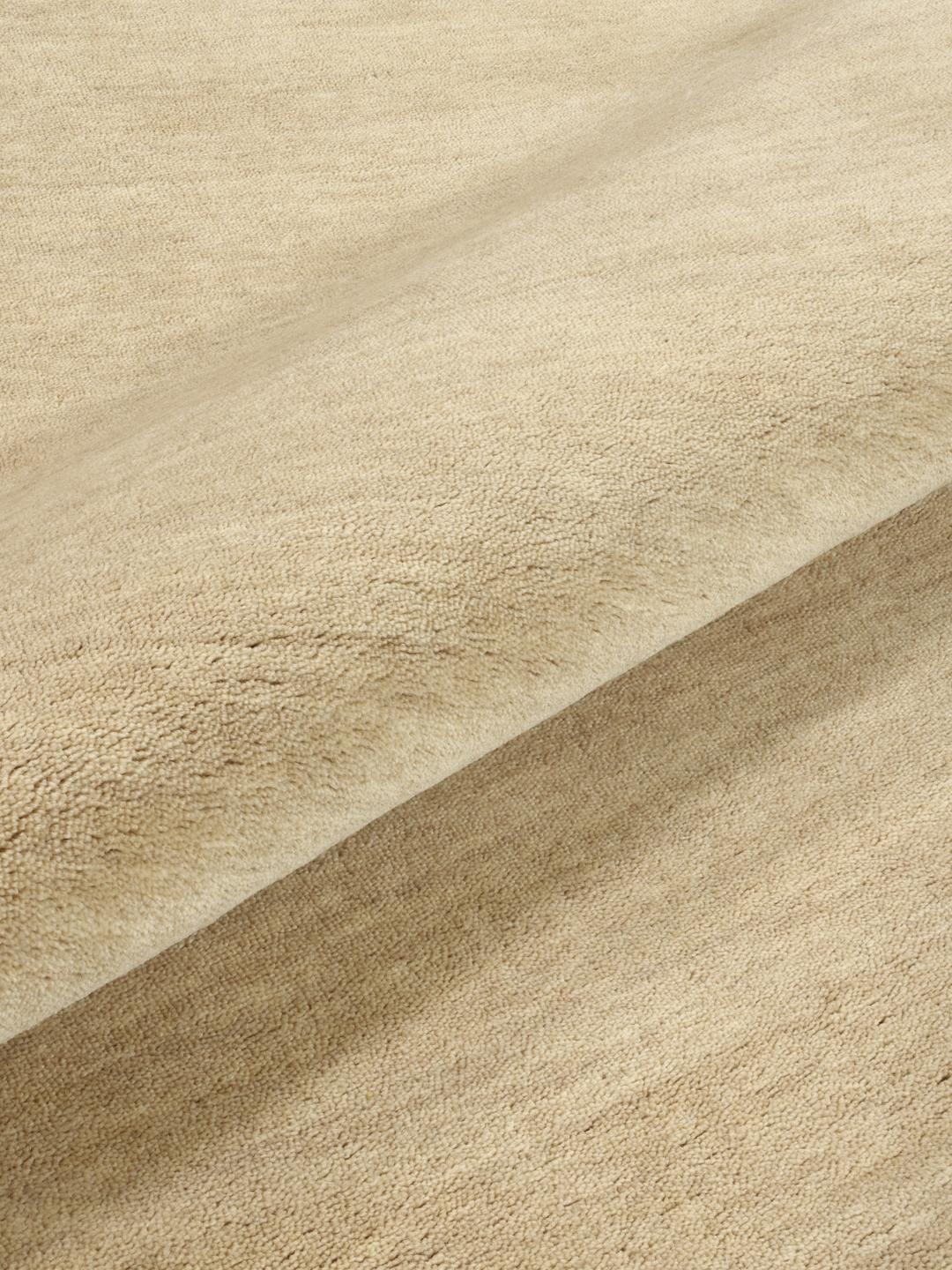 Beige rond hoogpolig vloerkleed