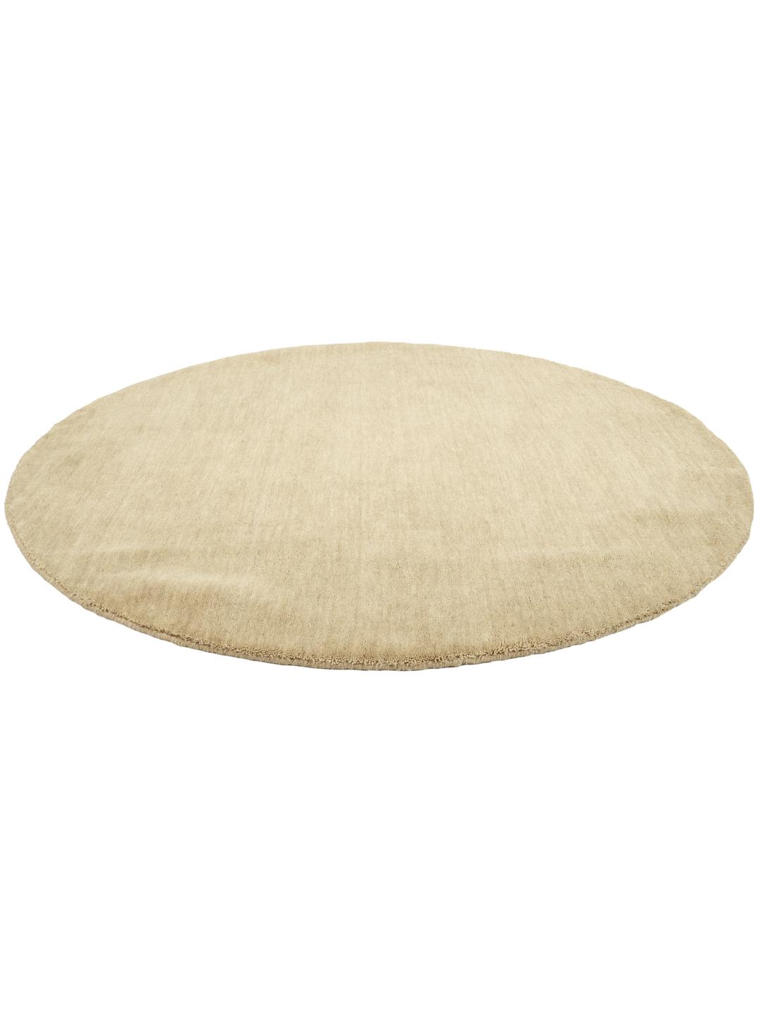 Beige rundt tæppe med luv