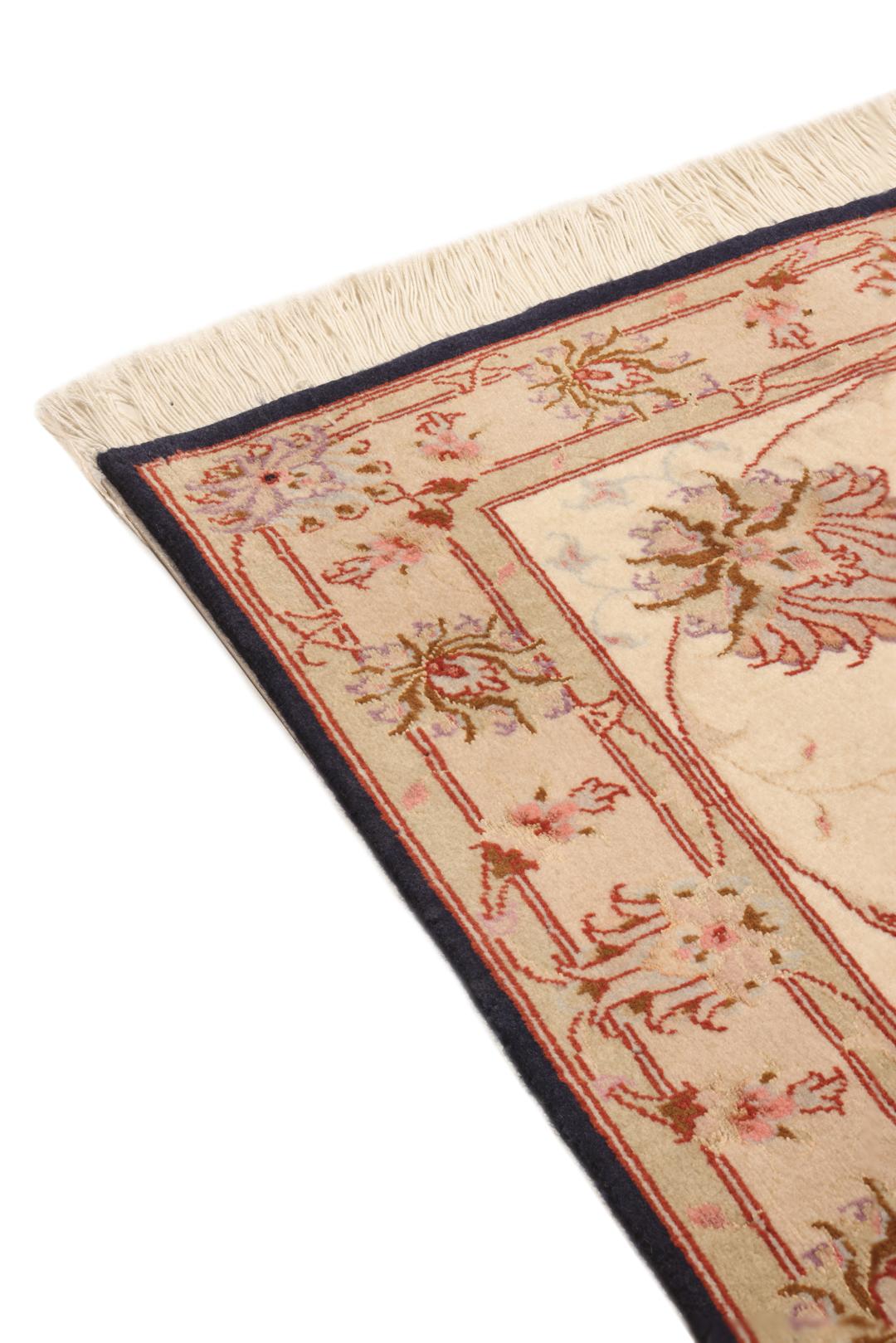 Hand-knotted Tabriz rug with a black field and floral patterns from the Middle East