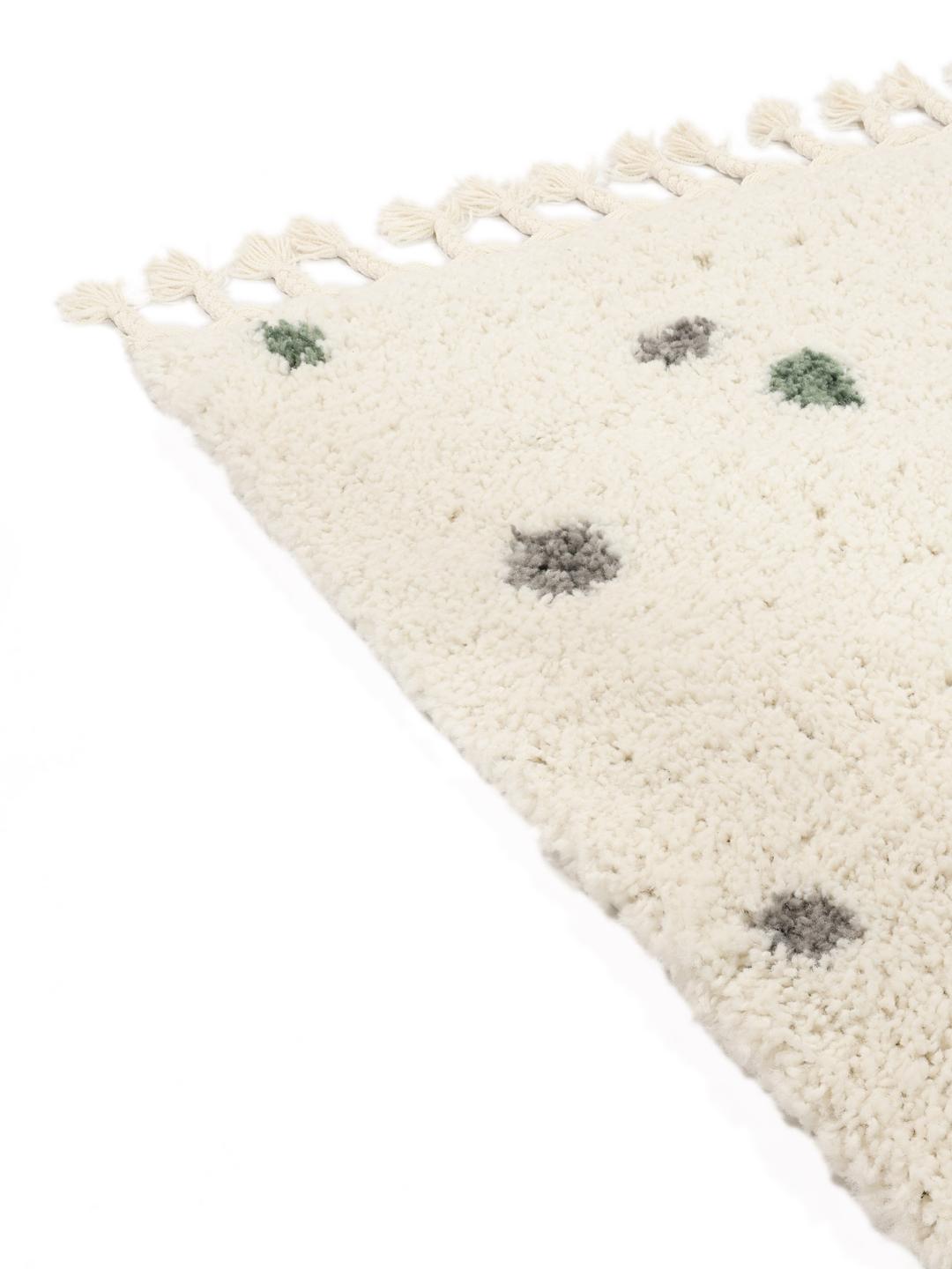 wit vloerkleed met kleurrijke details en franjes