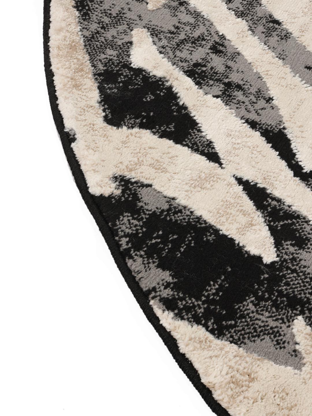 Rond tapijt in zwart en beige