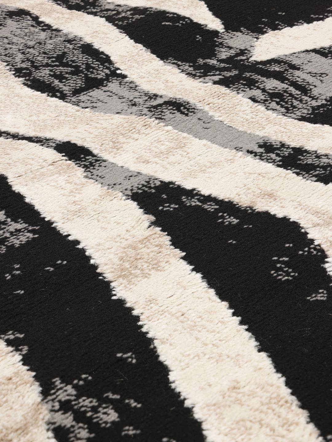 Rond tapijt in zwart en beige
