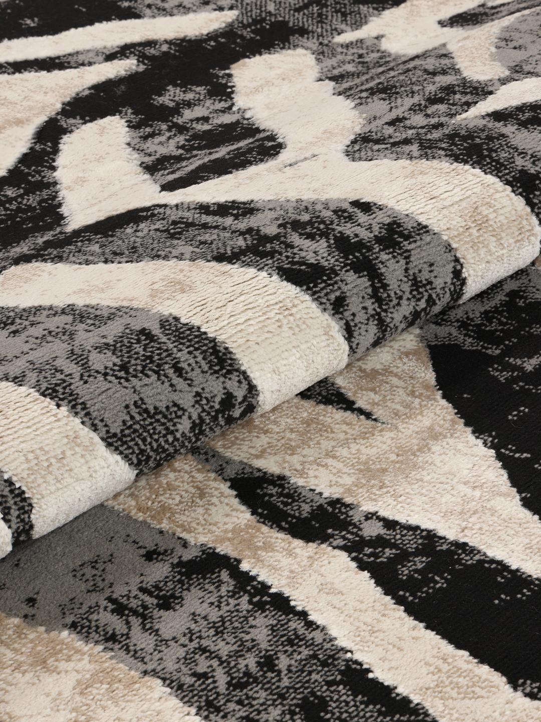 Rond tapijt in zwart en beige