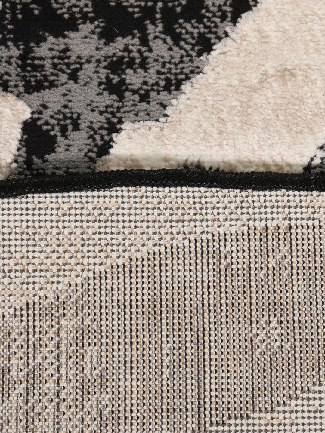 Rond tapijt in zwart en beige