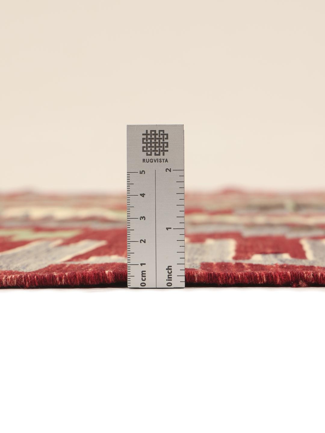 Handgeweven Turks kelimkleed met levendige geometrische patronen in rood, groen en grijs