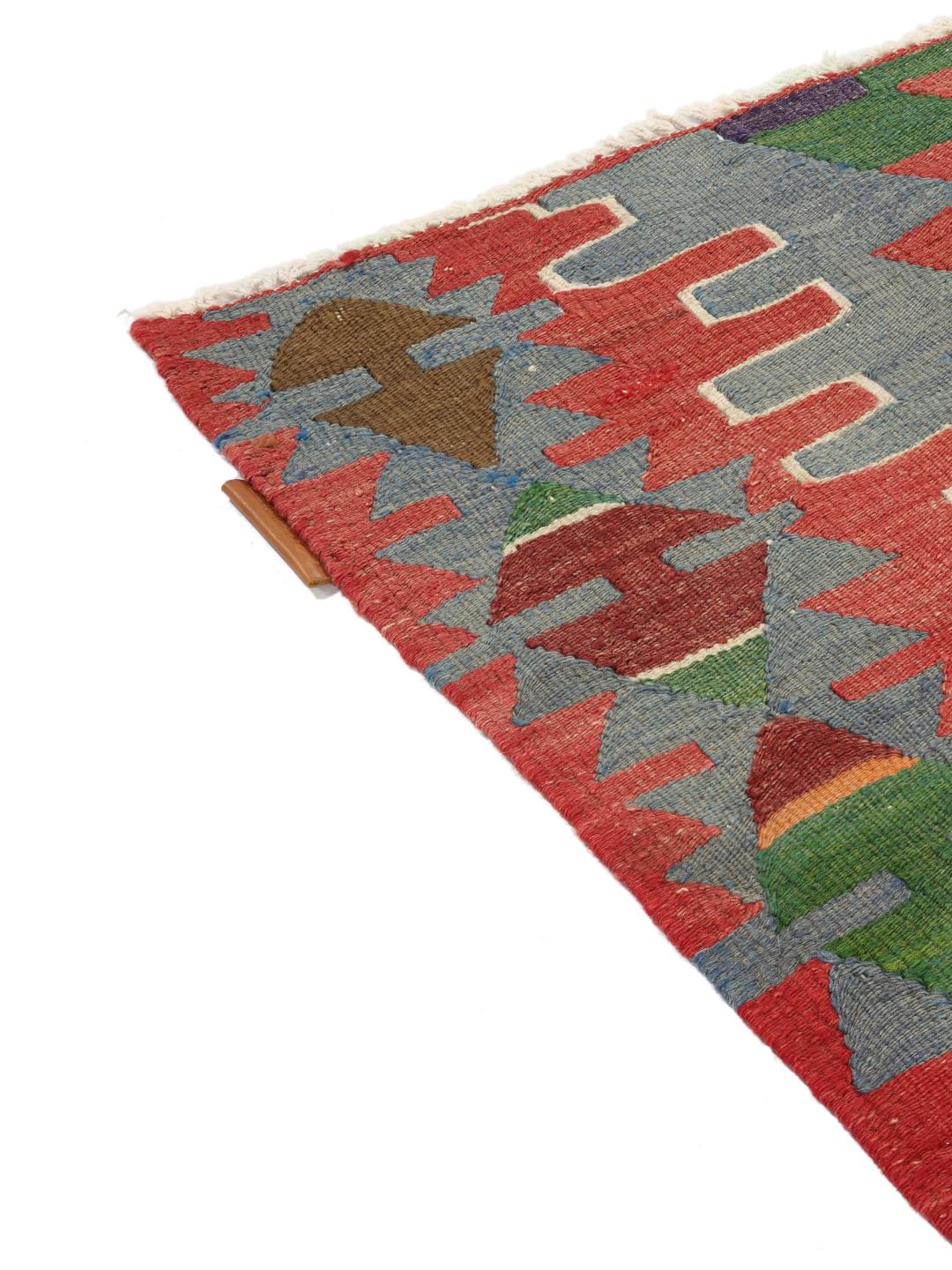 Tapis kelim turc vintage tissé à la main avec des motifs géométriques en losanges multicolores