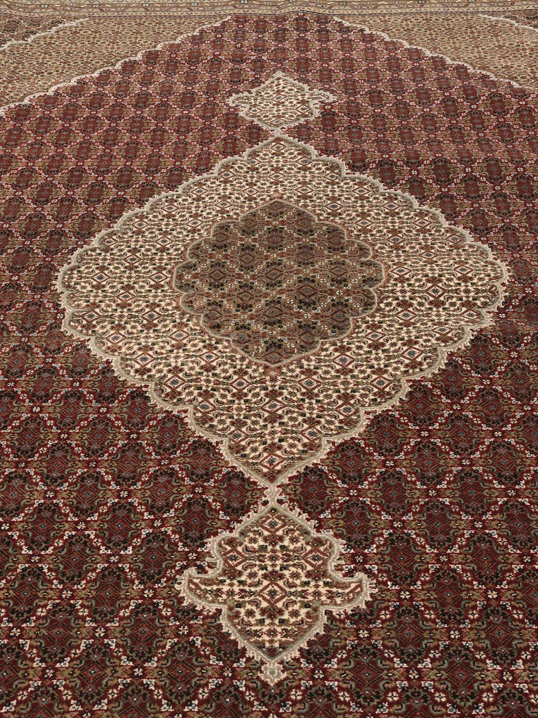 Tabriz Royal hand-knotted wool rug from India in deep red and beige tones