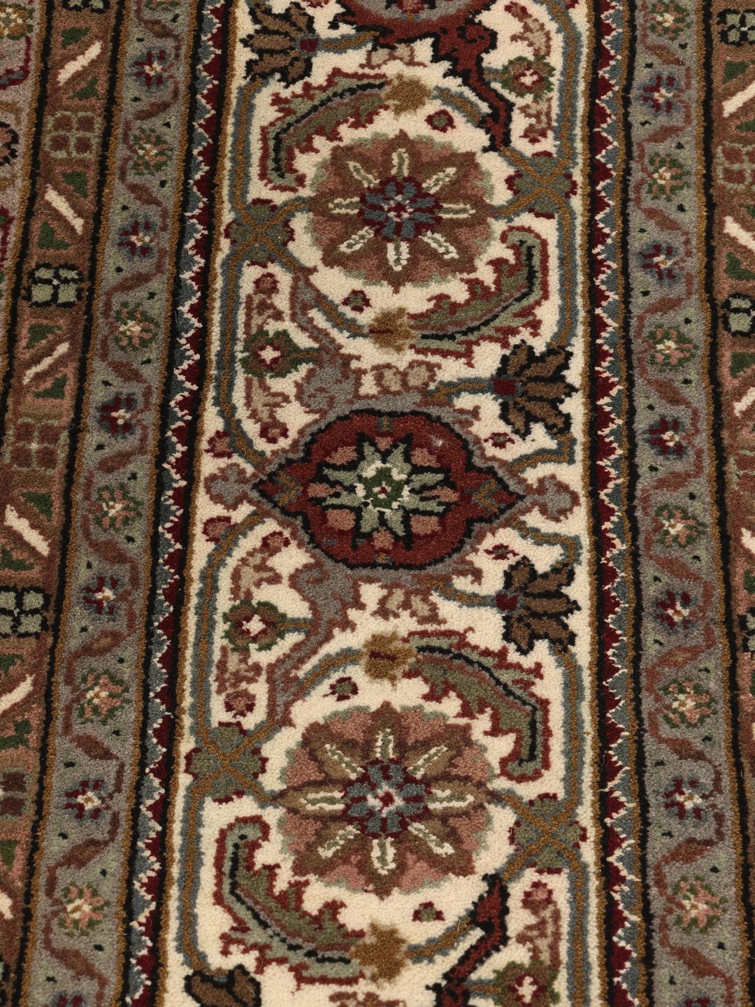Tabriz Royal hand-knotted wool rug from India in deep red and beige tones