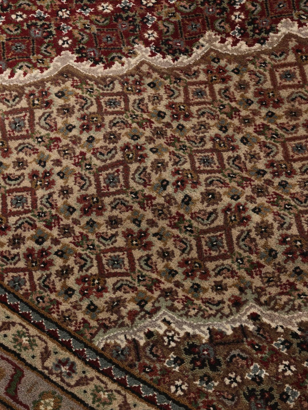 Tabriz Royal hand-knotted wool rug from India in deep red and beige tones