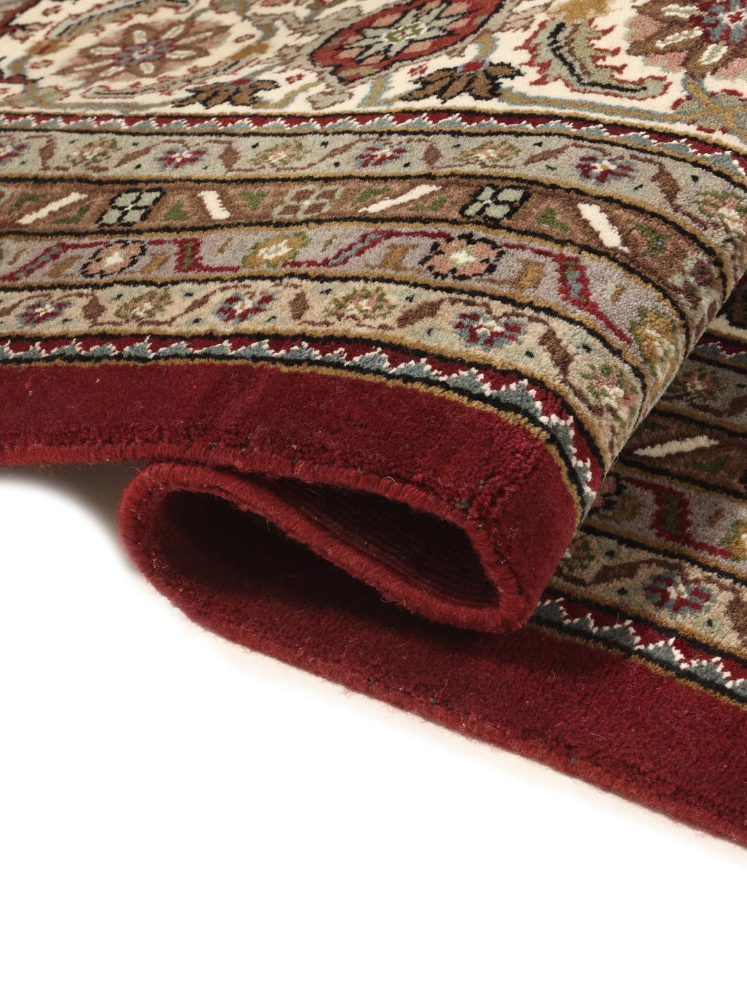 Tabriz Royal hand-knotted wool rug from India in deep red and beige tones