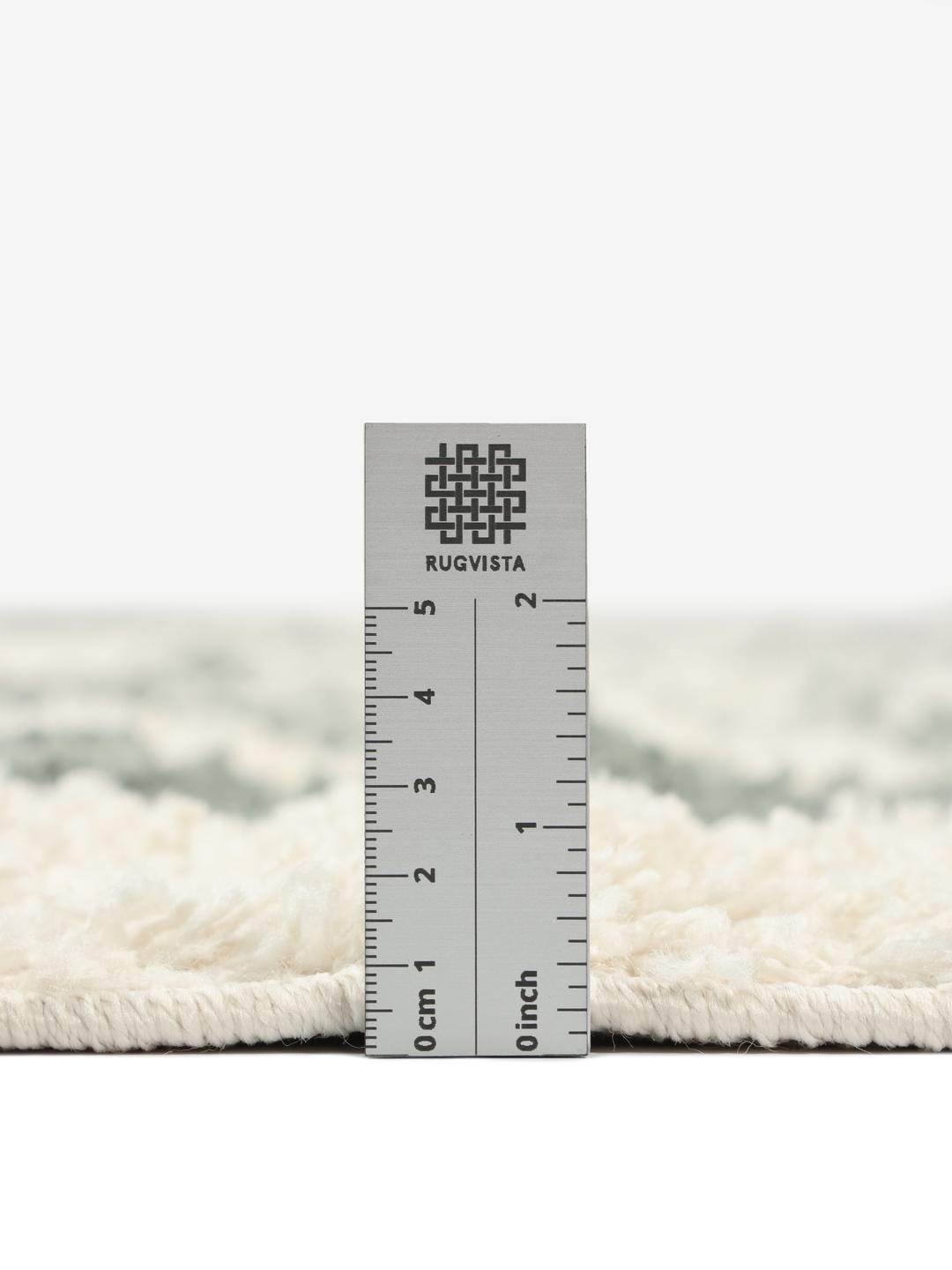 Groen vloerkleed met een pluche pooltextuur