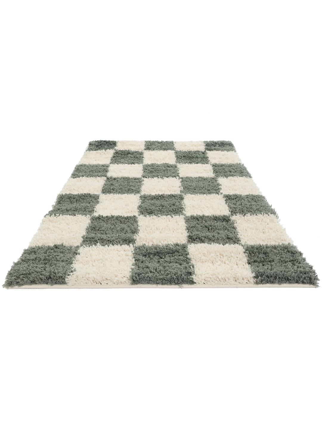 Groen vloerkleed met een pluche pooltextuur