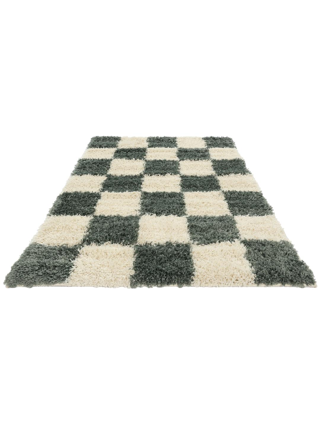 Groen vloerkleed met een pluche pooltextuur