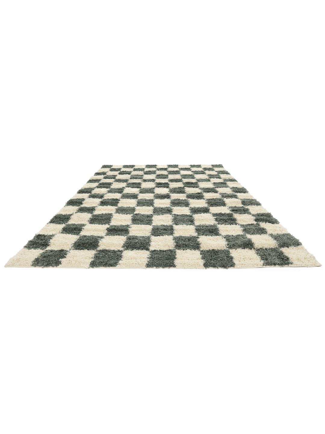 Groen vloerkleed met een pluche pooltextuur