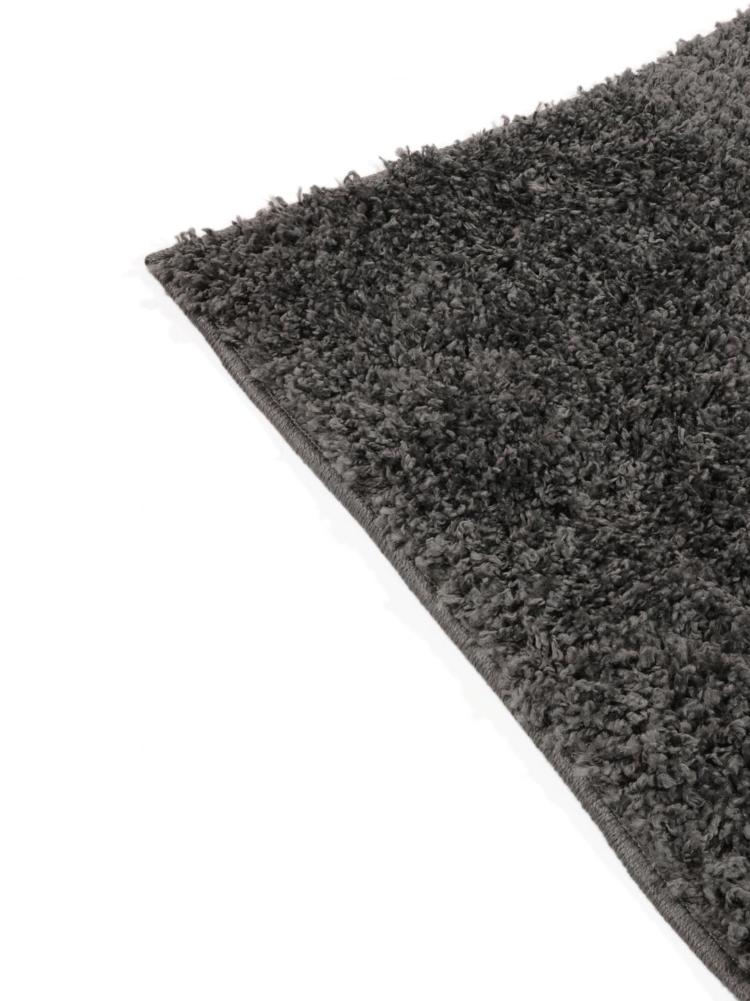 Donkergrijs vloerkleed met een dikke pool textuur