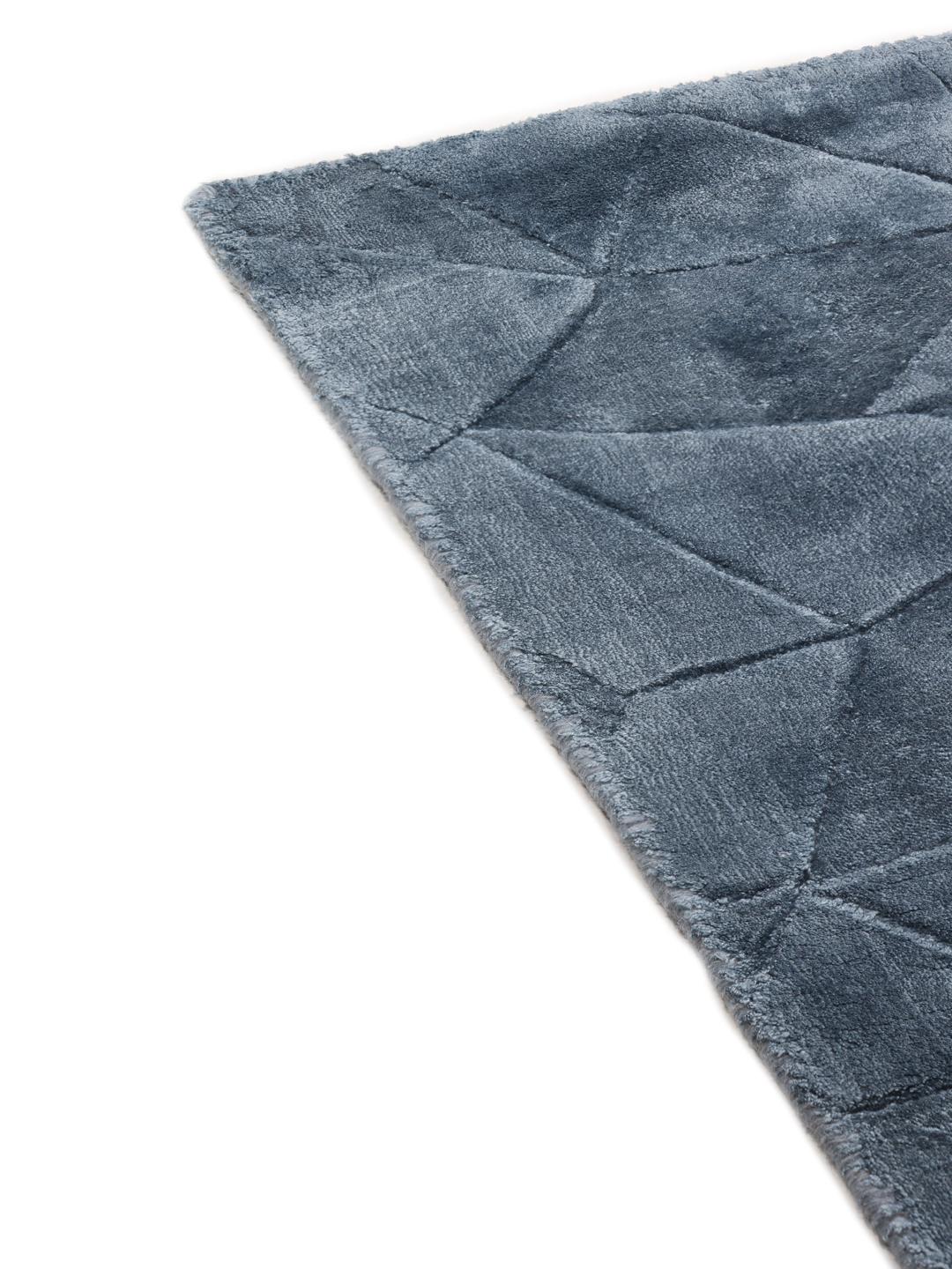 Modern blauw vloerkleed met geometrisch patroon