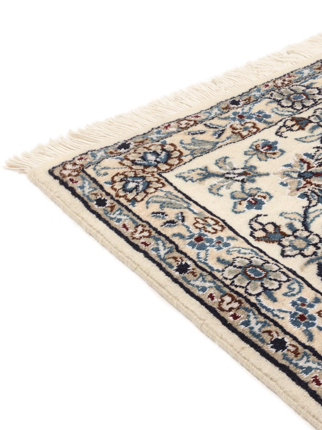 Hand-knotted Nain rug from the Middle East with a dark-blue and cream floral design