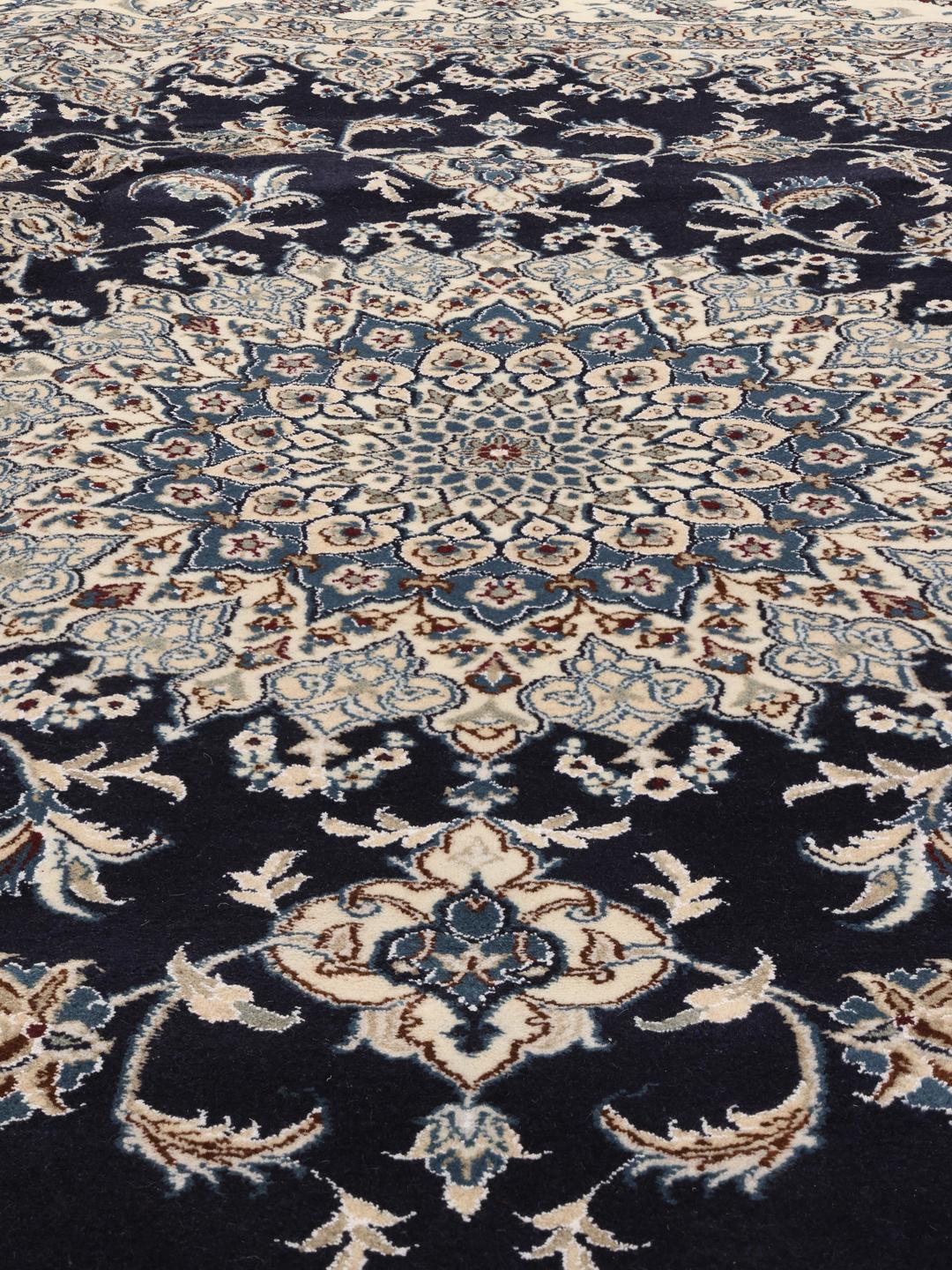Hand-knotted Nain rug from the Middle East with a dark-blue and cream floral design