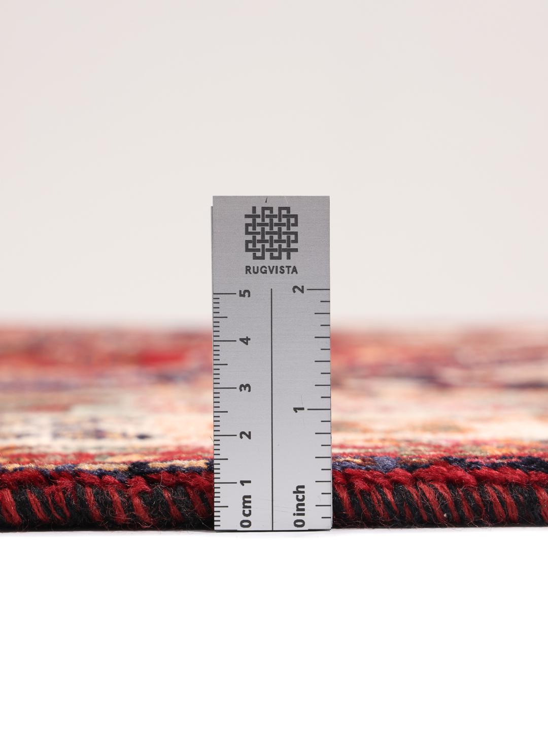 Handgeknoopt Ghashghai tapijt uit het Midden-Oosten in rode en donkerblauwe tinten.