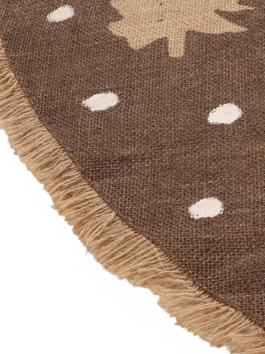 Round brown rug with pine tree and dot pattern