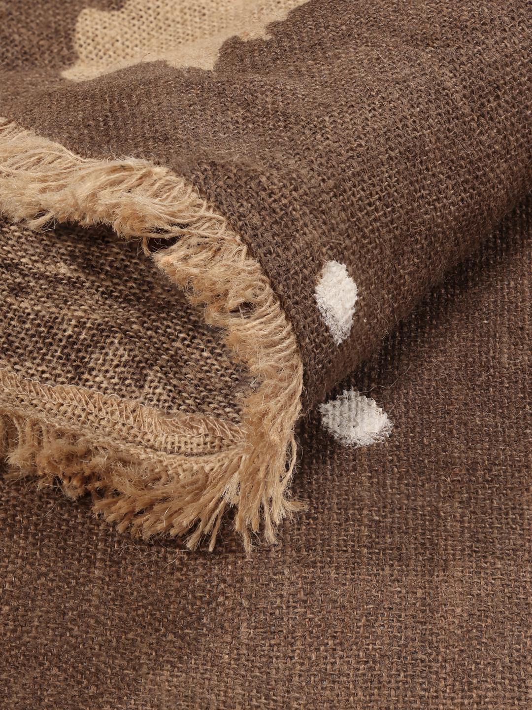 Round brown rug with pine tree and dot pattern