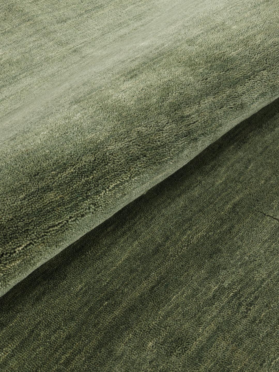 Okrągły ręcznie tkany dywan w kolorze leśnej zieleni