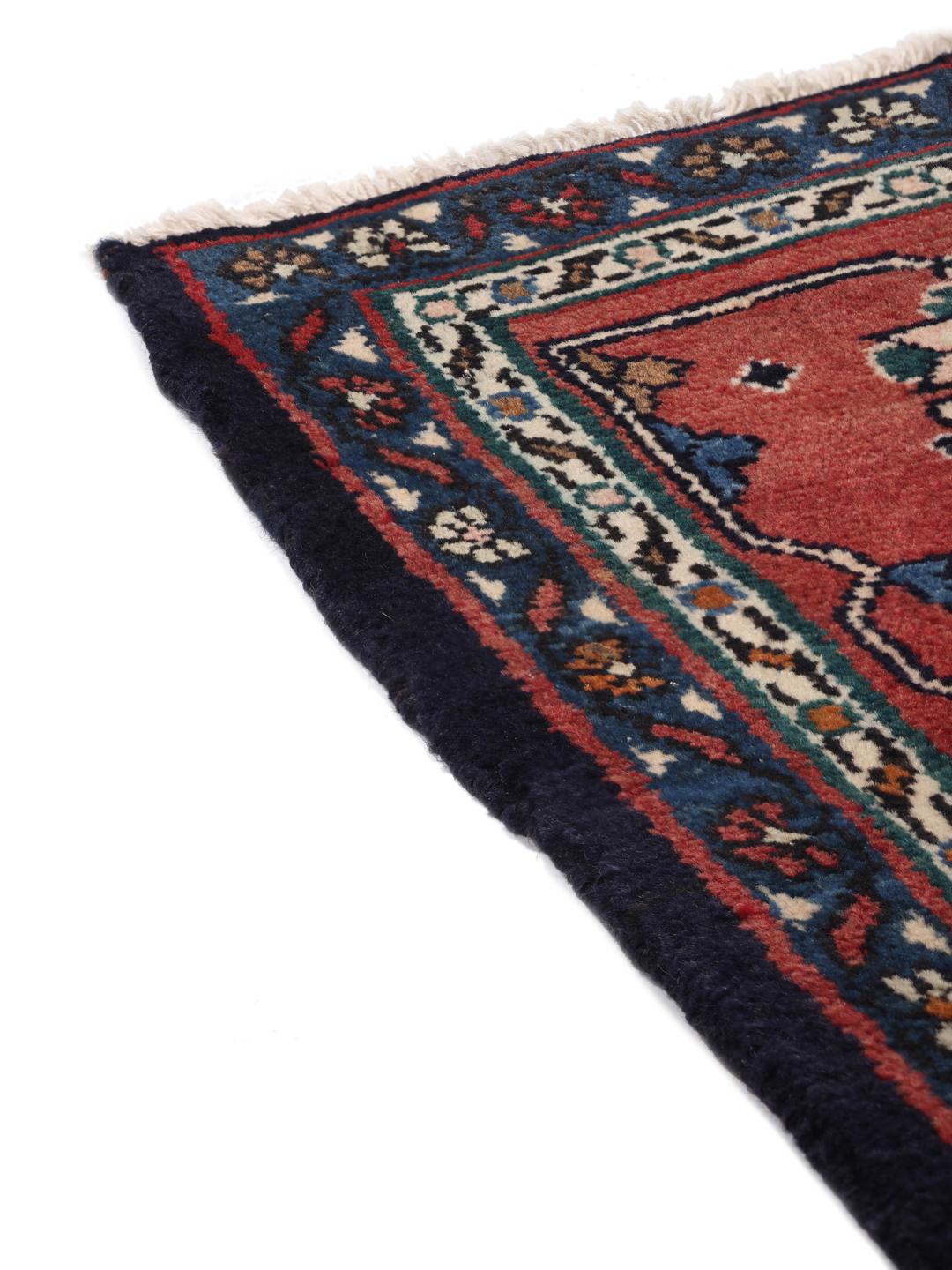 Handgeknoopt Koliai-tapijt uit het Midden-Oosten met een rood en blauw kleurenpalet