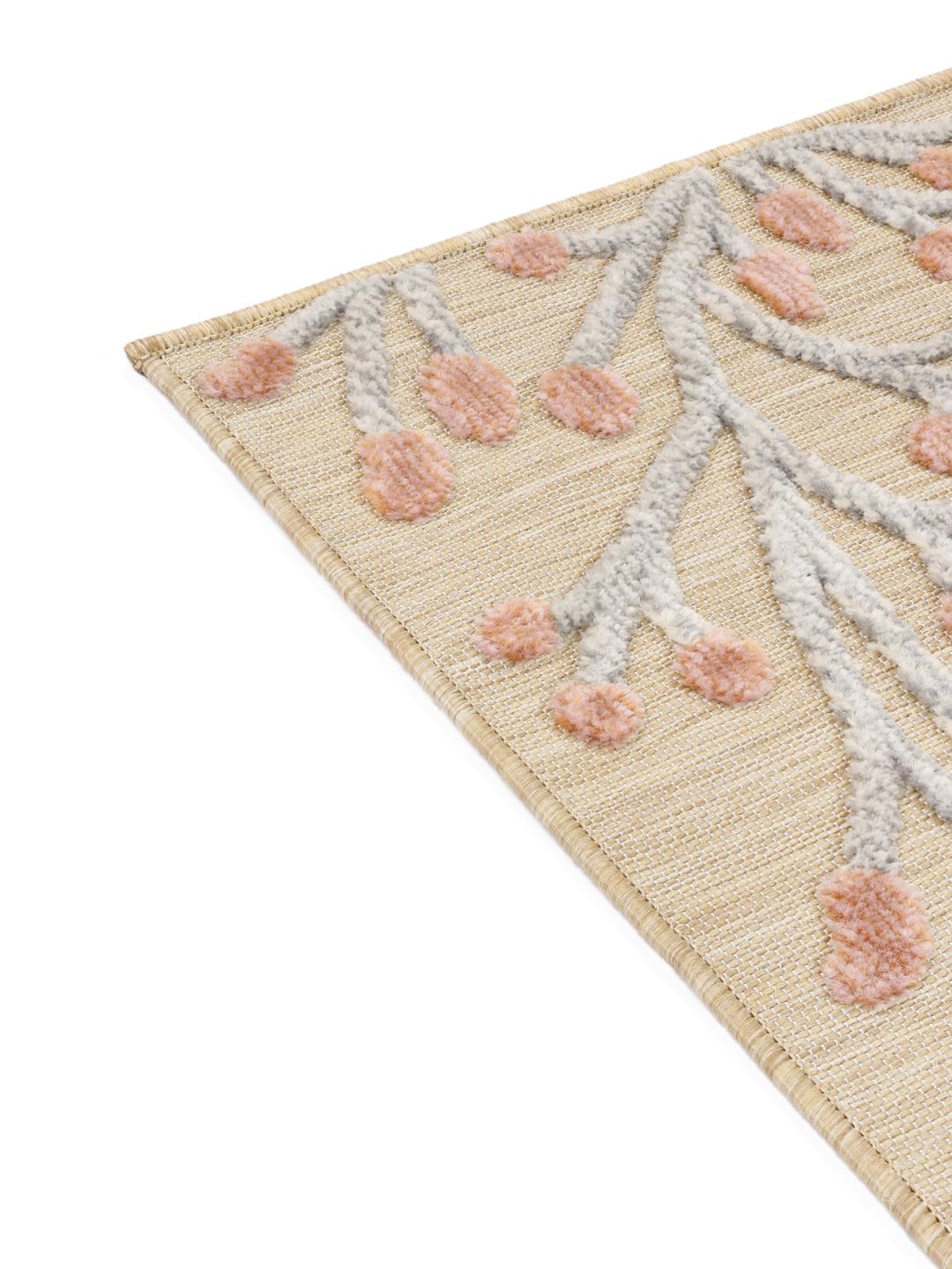 Beige og lyserødt blomstret tæppe