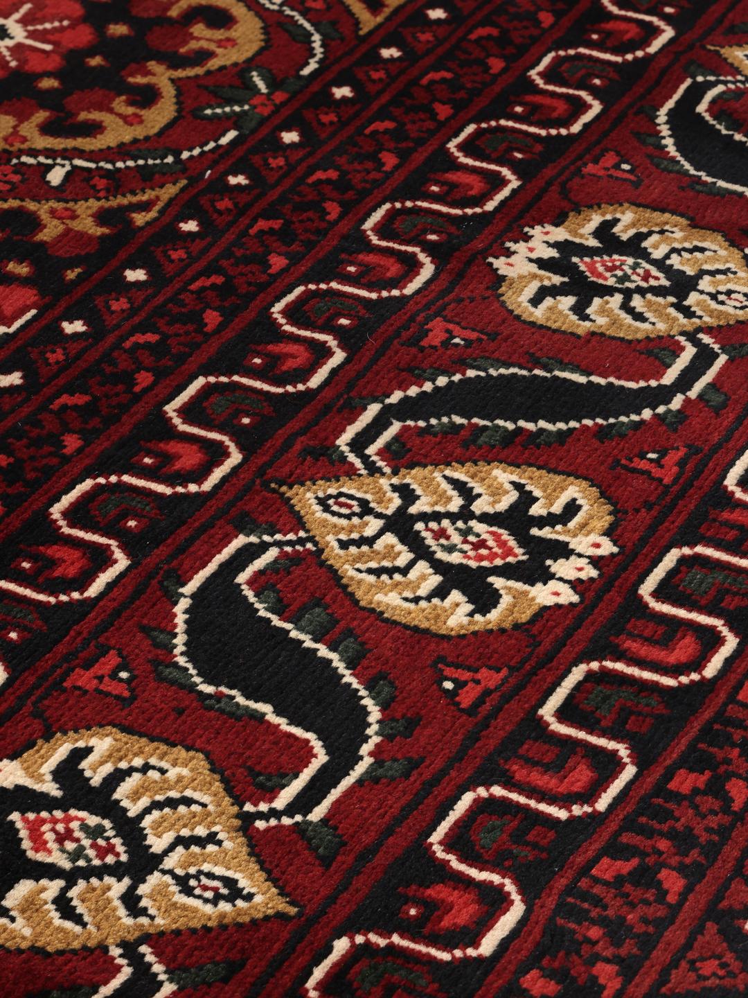 Hand-knotted Afghan Kunduz rug in dark-red with geometric medallions