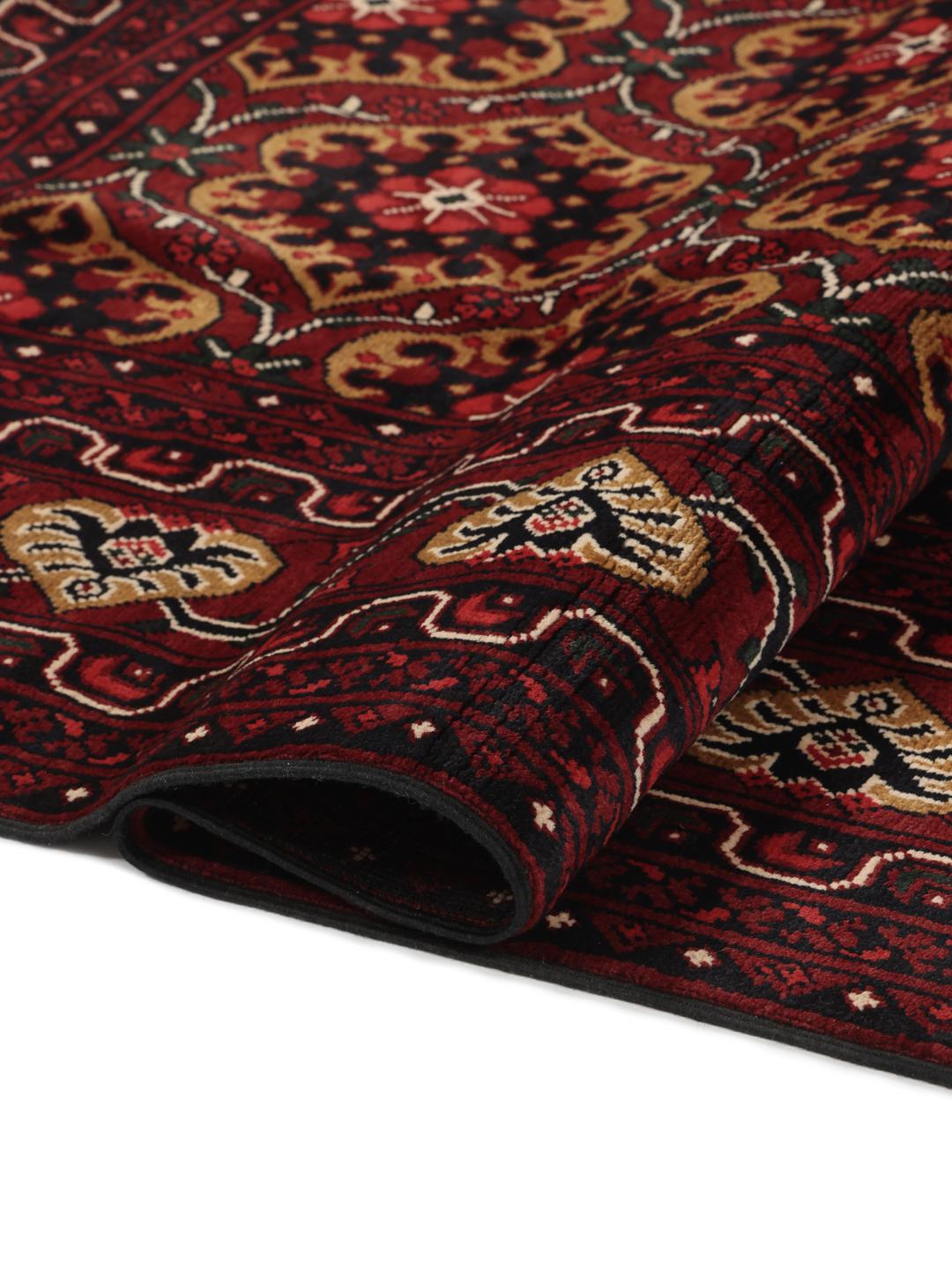 Hand-knotted Afghan Kunduz rug in dark-red with geometric medallions