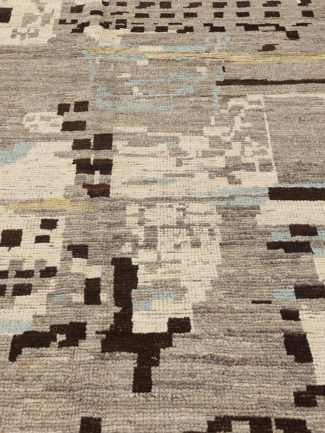Hand-knotted Afghan rug with abstract patterns in grey, brown, and light blue