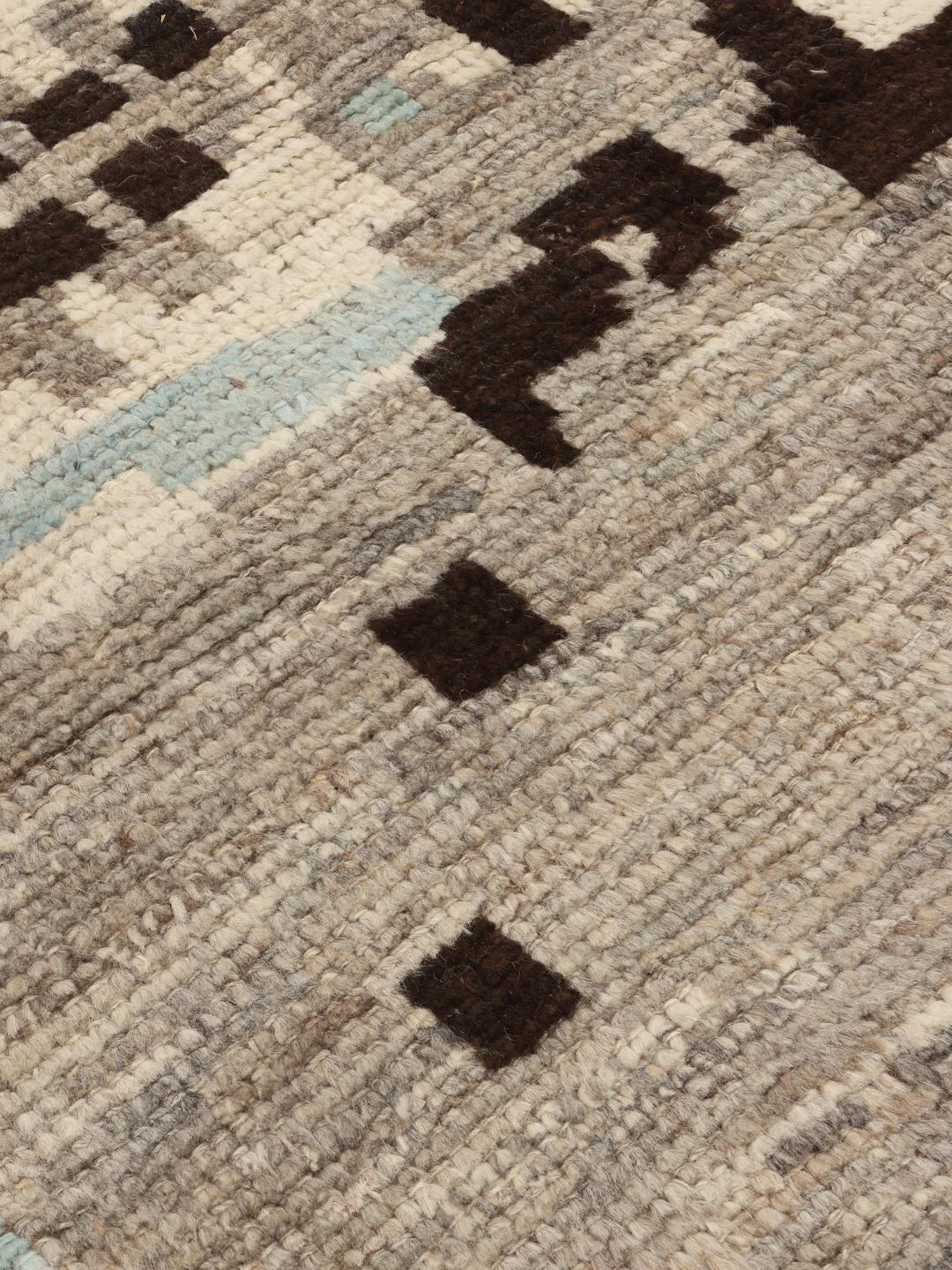 Hand-knotted Afghan rug with abstract patterns in grey, brown, and light blue