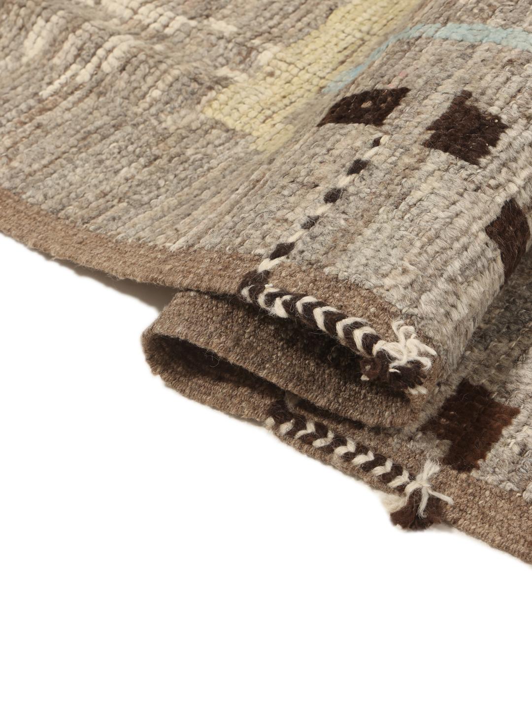 Hand-knotted Afghan rug with abstract patterns in grey, brown, and light blue