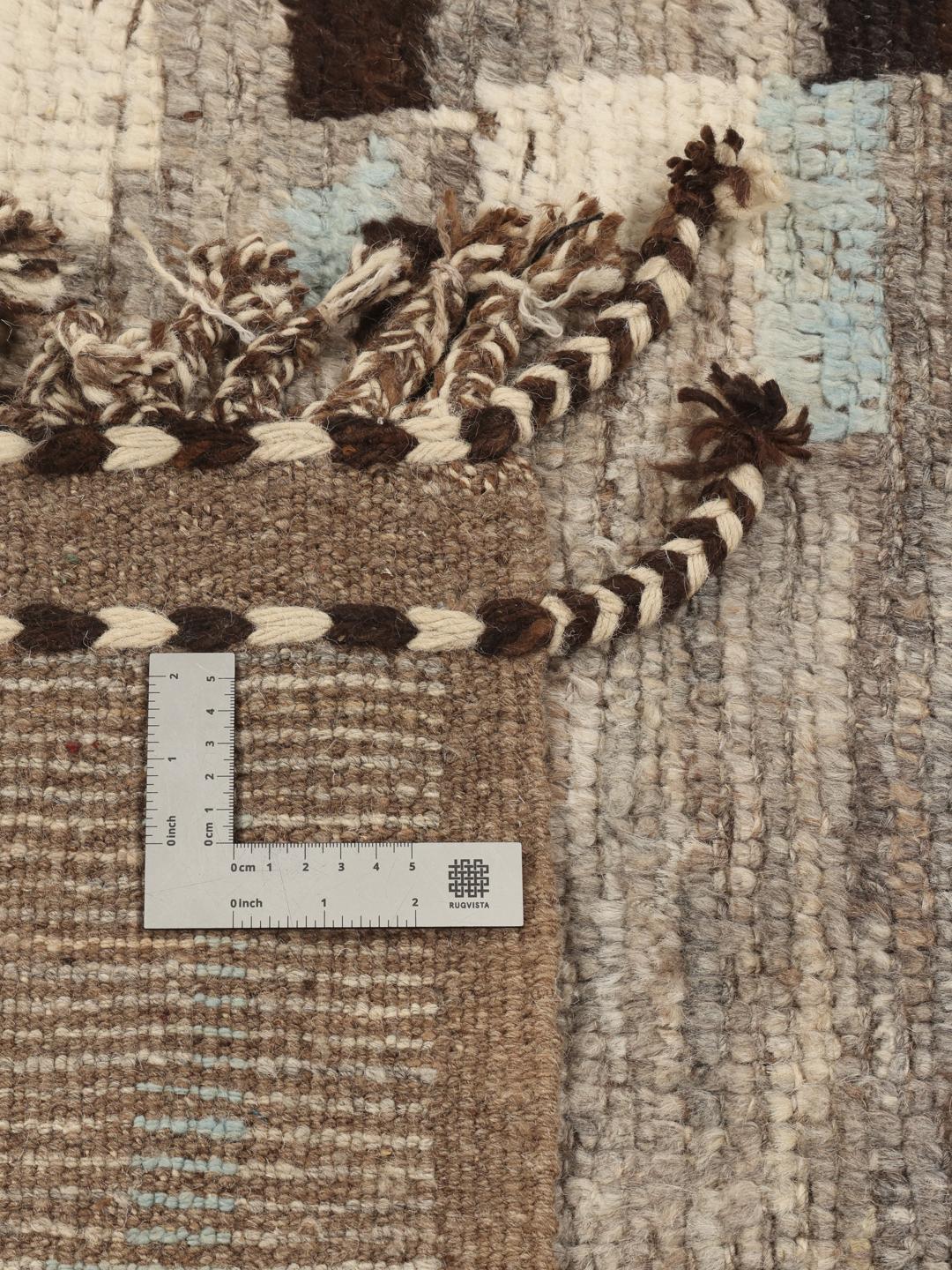 Hand-knotted Afghan rug with abstract patterns in grey, brown, and light blue