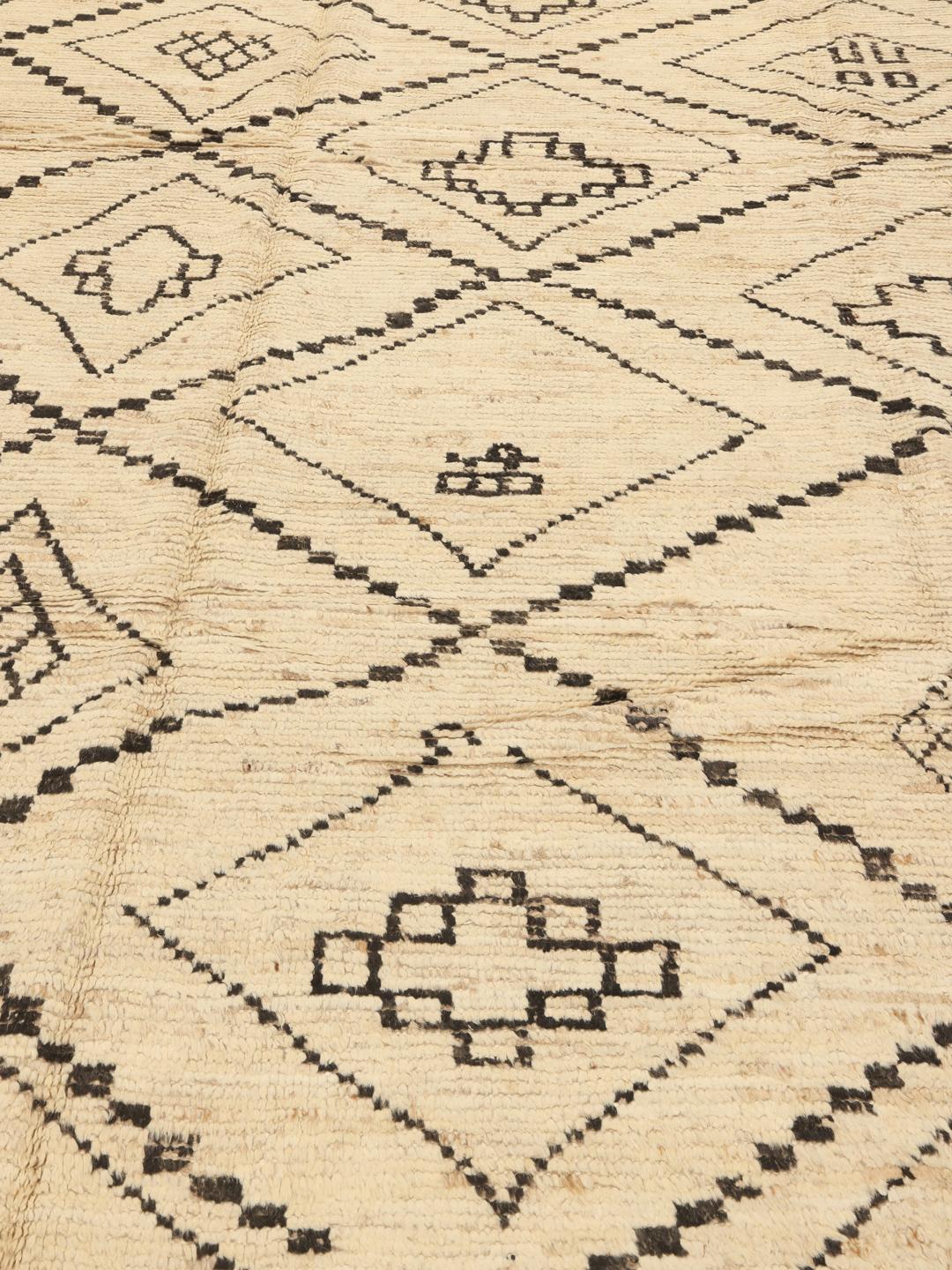 Hand-knotted Afghan rug with beige field and black geometric tribal motifs