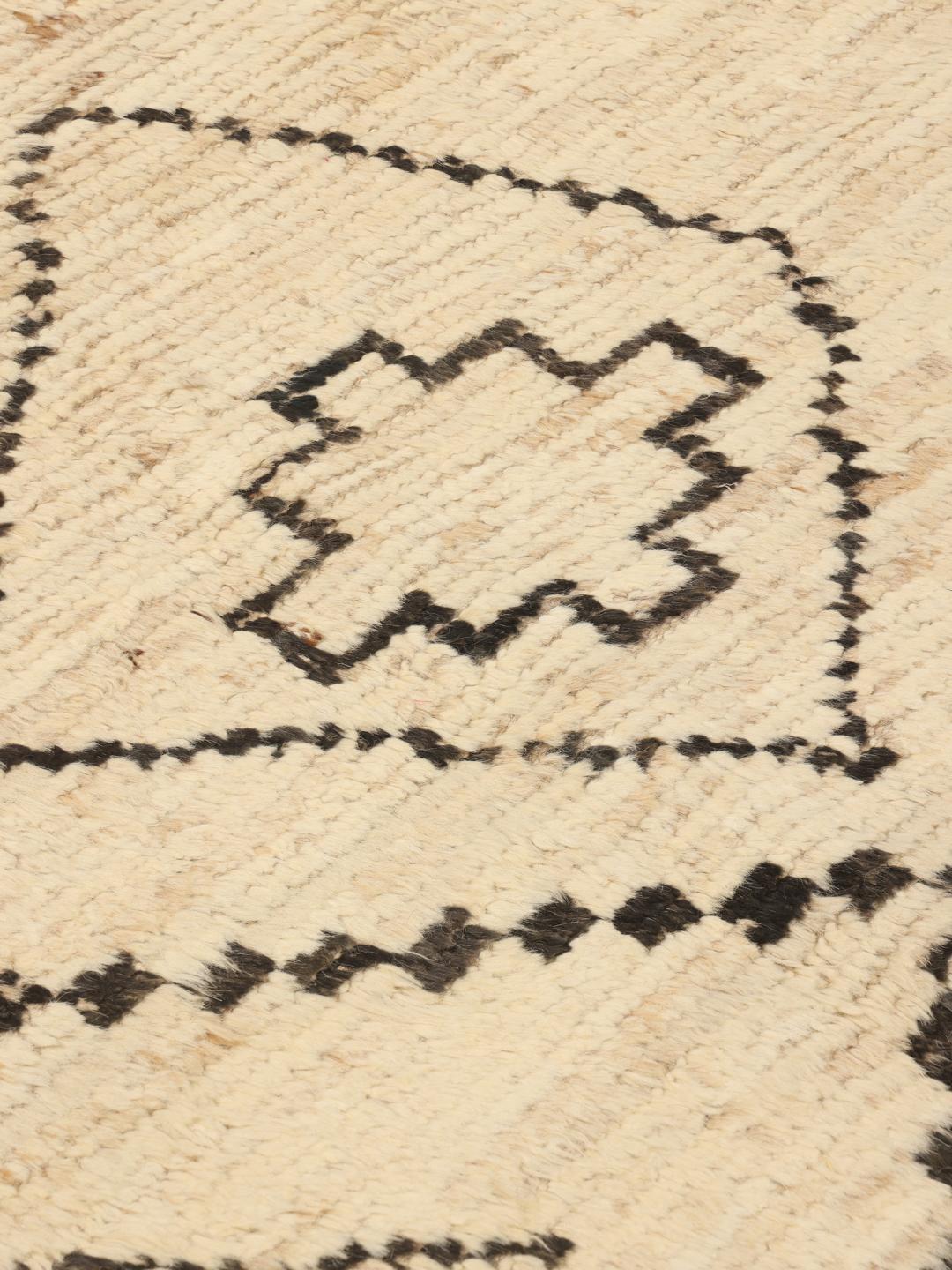 Hand-knotted Afghan rug with beige field and black geometric tribal motifs