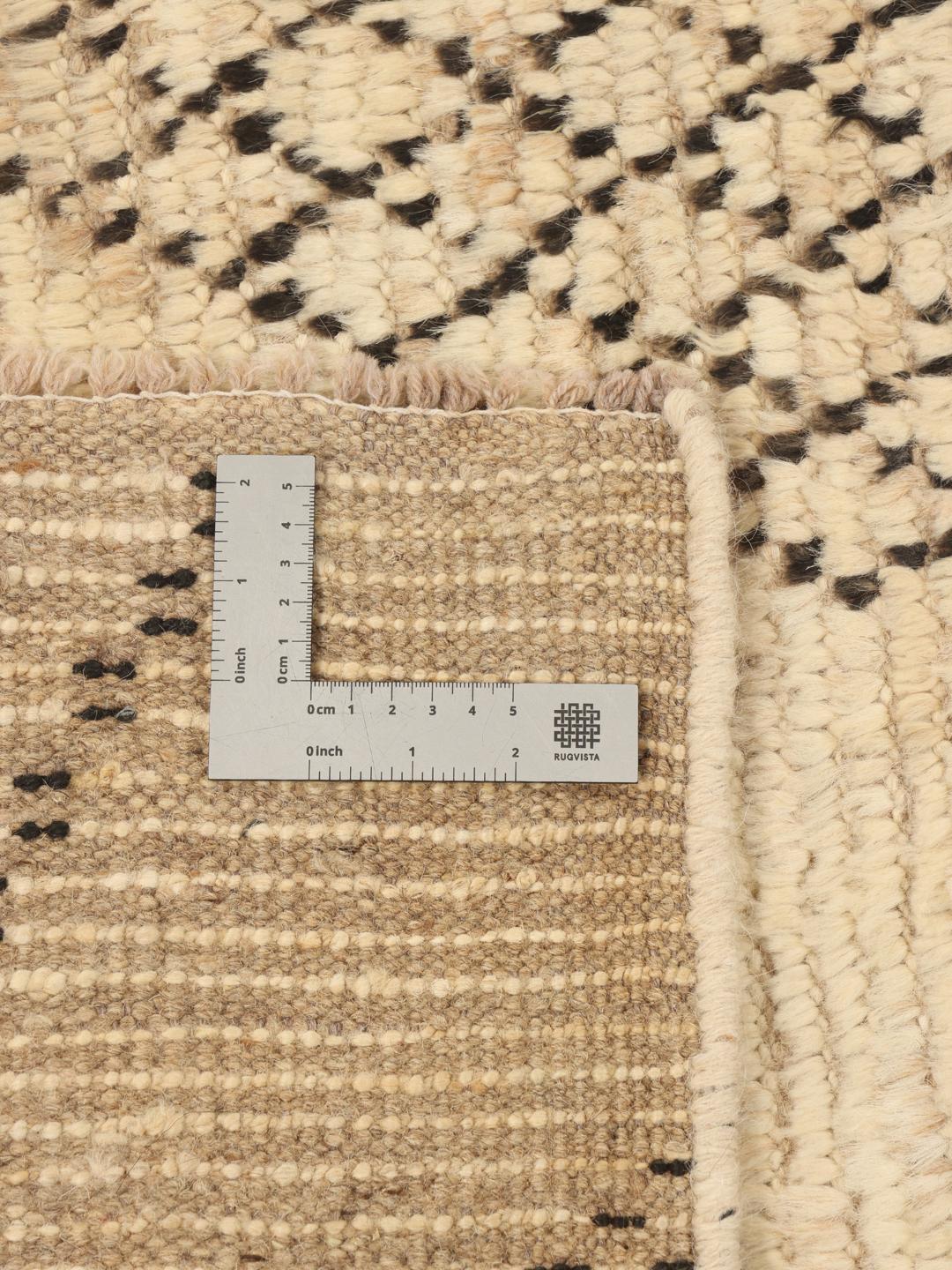 Hand-knotted Afghan rug with beige field and black geometric tribal motifs